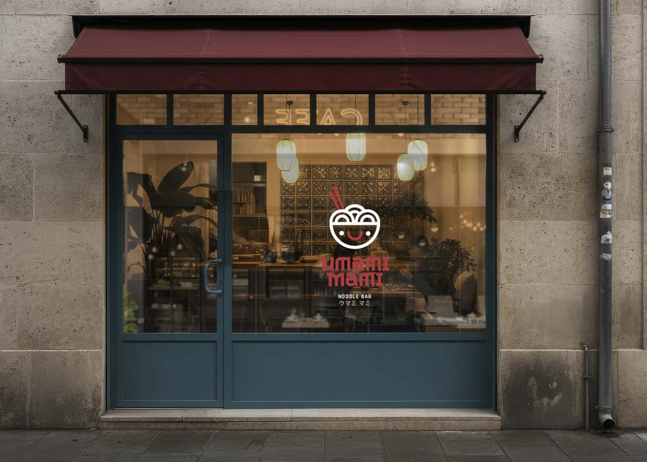 Storefront with a blue frame and a maroon awning. The glass door features a smiling bowl logo in vinyl transfer and the text "Umami Mami Noodles Soup."