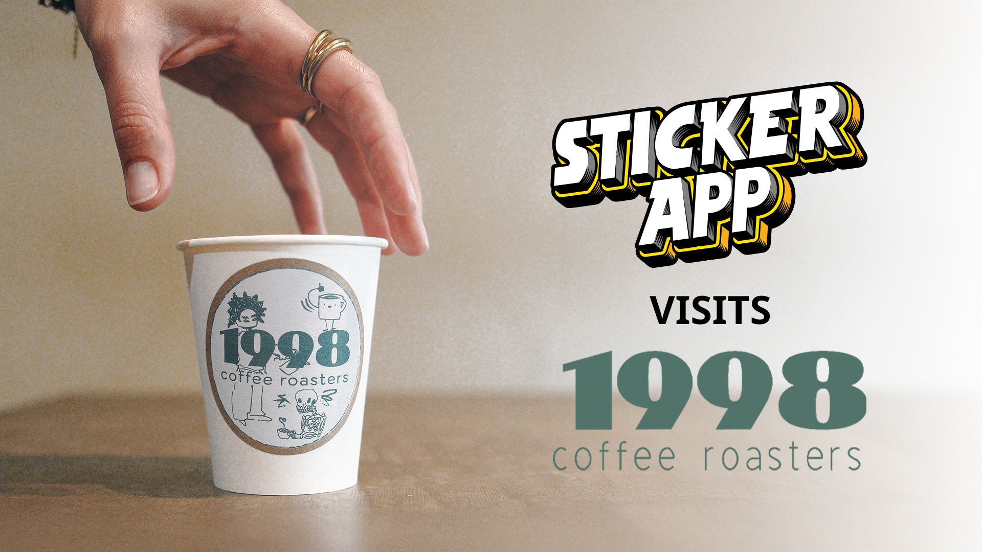 Hand placing a paper cup with "1998 coffee roasters" logo on a table; "Sticker App visits 1998 coffee roasters" text above.